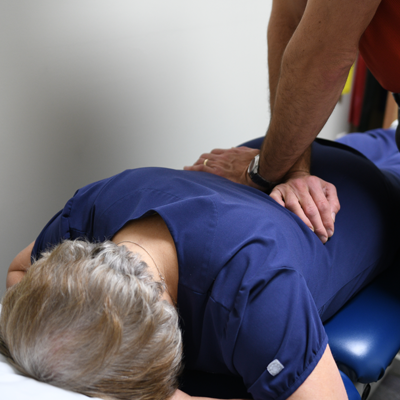 Occupational therapist working on patient's back